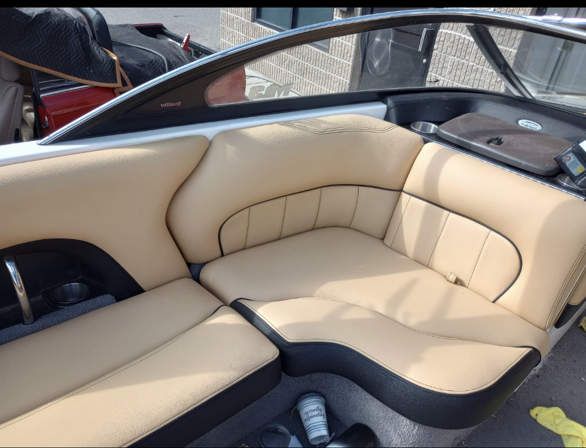 Finished cream and black custom seating with detailed upholstery seams